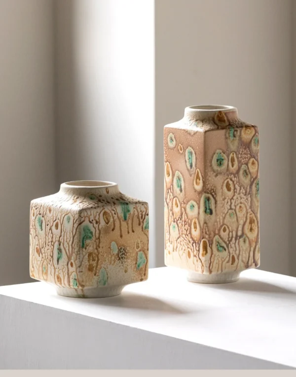 Kiln-Change Speckled Ceramic Vases in sand — in a room setting