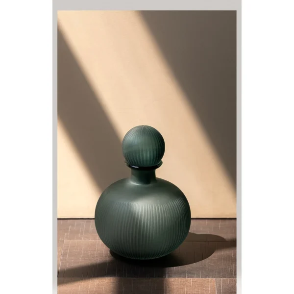 Mist Blue Ribbed Frosted Glass Bottle Vase with Ball Stopper in blue — in a room setting