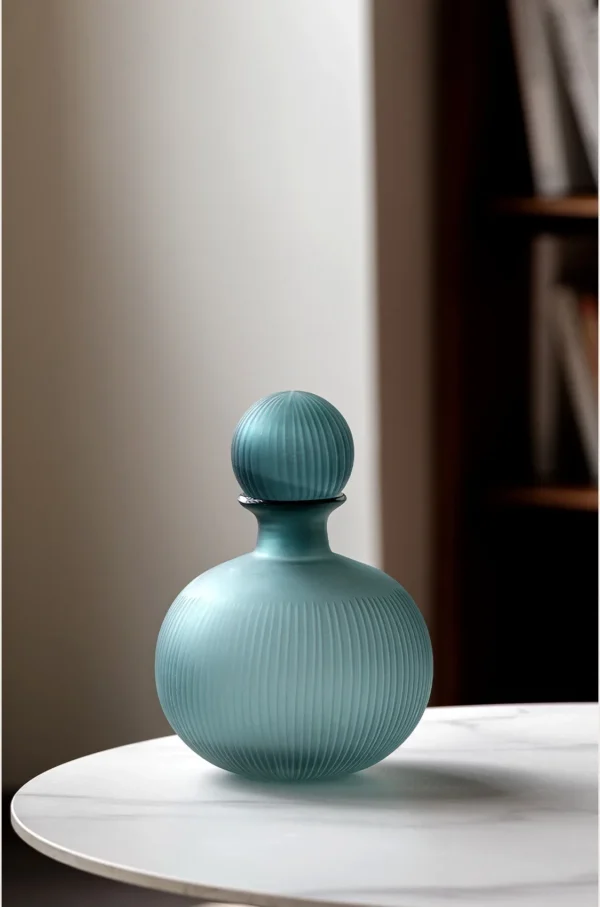 Mist Blue Ribbed Frosted Glass Bottle Vase with Ball Stopper in blue — in a room setting