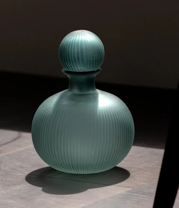 Mist Blue Ribbed Frosted Glass Bottle Vase with Ball Stopper in blue — in a room setting