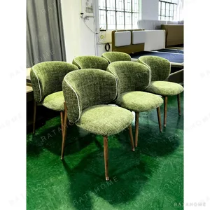 Olive Green Curved-Back Dining Chair on Walnut Legs in olive — in a room setting