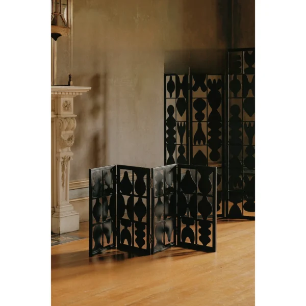 Vessel-Silhouette Openwork Folding Screen in black — in a room setting