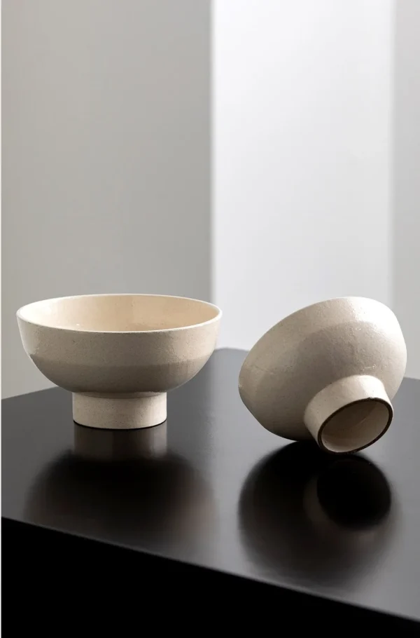 Sand-Cream Stoneware Footed Bowls in oatmeal — in a room setting