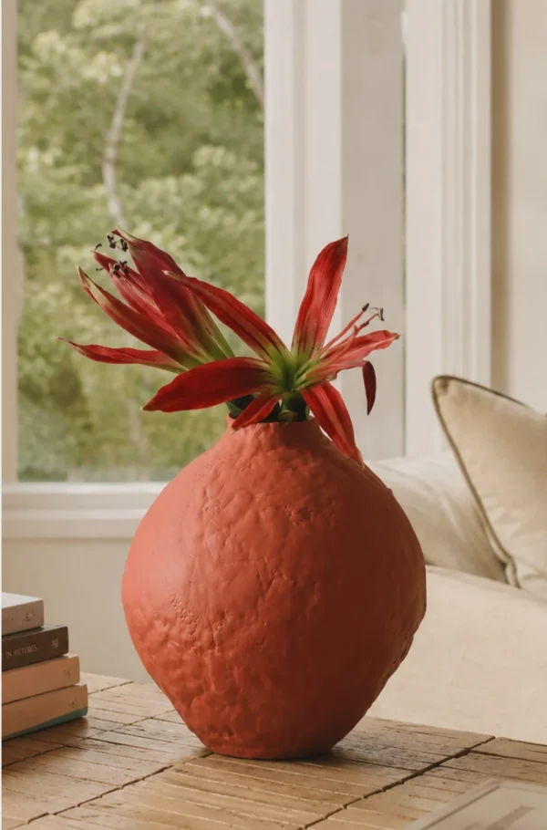 Hand-Pinched Red Clay Round Vase with Torn Rim in rust — in a room setting
