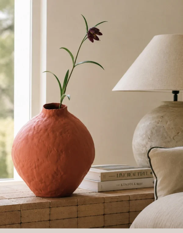 Hand-Pinched Red Clay Round Vase with Torn Rim in rust — in a room setting