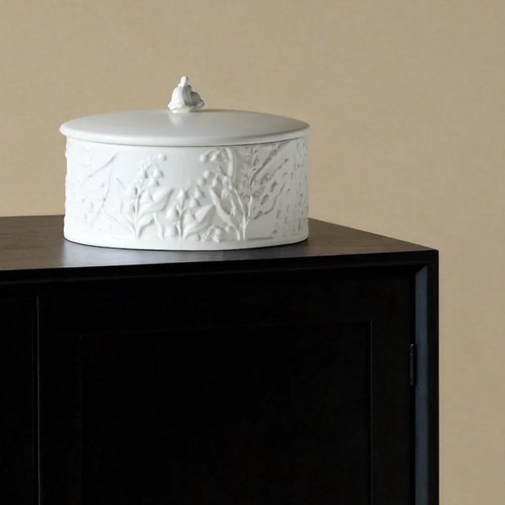 Vintage Relief Lily of the Valley Ceramic Storage Jar in ivory — front view