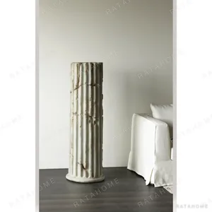 Fluted Roman Column Pedestal in Antiqued Cream, 140 cm — in a room setting