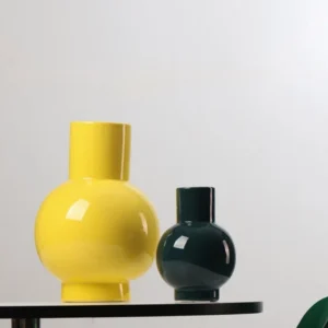 Glossy Round-Belly Ceramic Vases in Yellow, Green and White — in a room setting