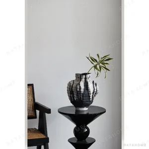 Pleated Stoneware Vase with Black Drip Glaze in black — in a room setting