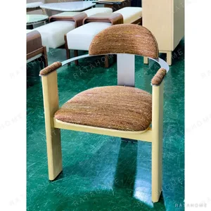 Light Wood Armchair with Curved Metal Back in Mixed Weave — in a room setting