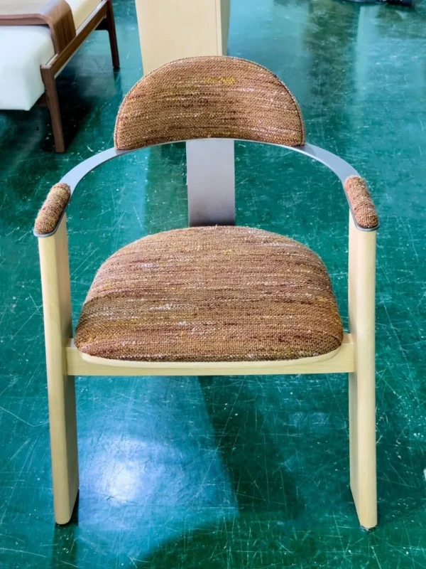 Light Wood Armchair with Curved Metal Back in Mixed Weave — in a room setting