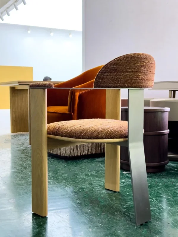 Light Wood Armchair with Curved Metal Back in Mixed Weave — in a room setting