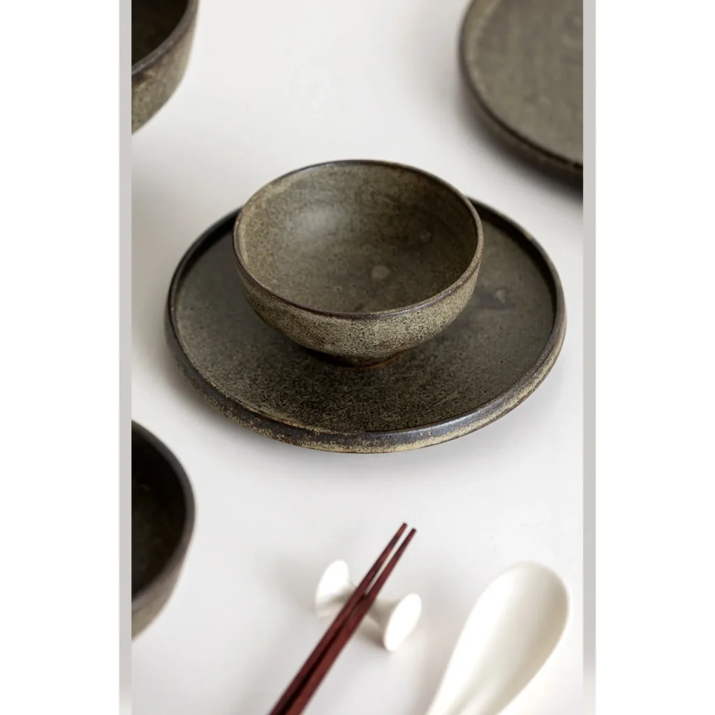 Vintage Textured Stoneware Footed Bowls and Plates in clay — in a room setting