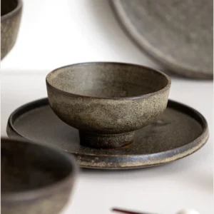 Vintage Textured Stoneware Footed Bowls and Plates in clay — in a room setting