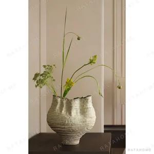 Hand-Made Twisted Pleated Vase in Pale Moss Glaze — in a room setting