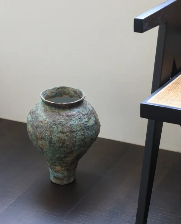 Jingdezhen Rust-Green Distressed Jar Vase, Tall or Short in olive — in a room setting