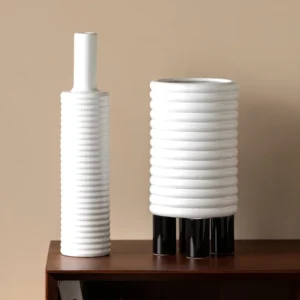 White Spiral-Ribbed Ceramic Vases in ivory — front view