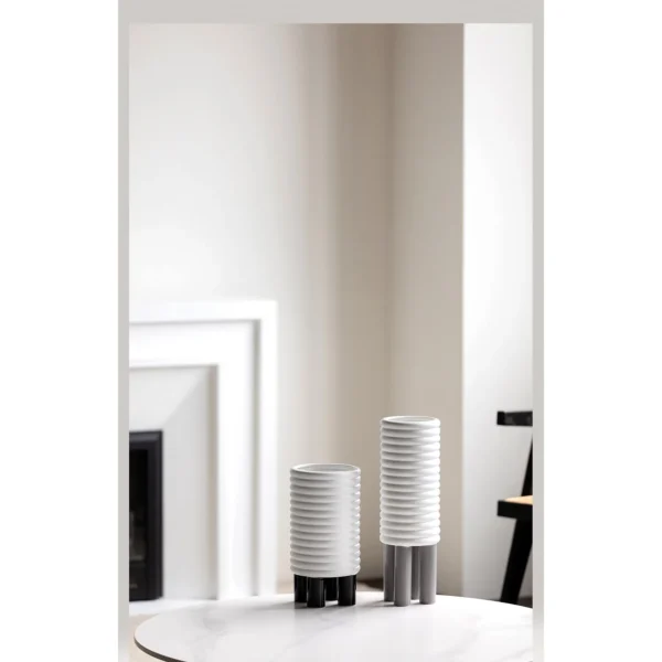 White Spiral-Ribbed Ceramic Vases in ivory — in a room setting