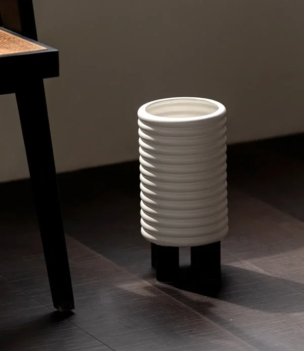 White Spiral-Ribbed Ceramic Vases in ivory — in a room setting