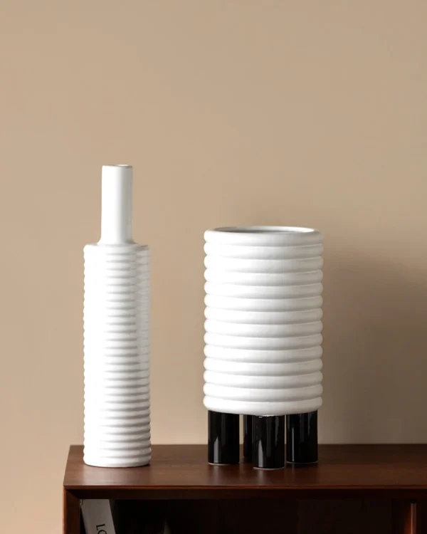 White Spiral-Ribbed Ceramic Vases in ivory — in a room setting