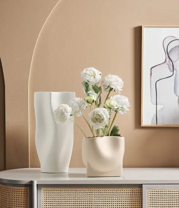 Matte Wave-Form Ceramic Vases in White, Green and Pink — in a room setting