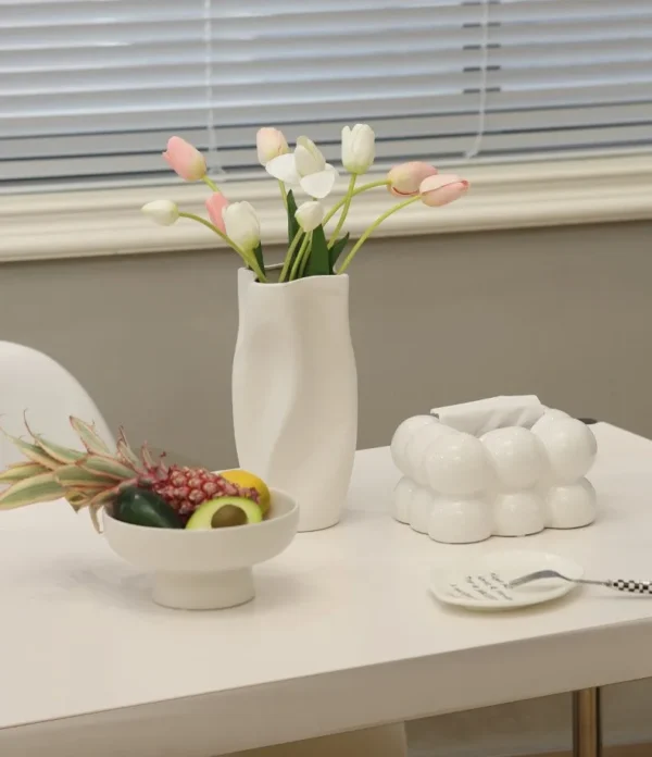 Matte Wave-Form Ceramic Vases in White, Green and Pink — in a room setting