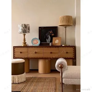 Vintage Scalloped-Trim Oak Sideboard on Cylinder Legs in natural oak — in a room setting