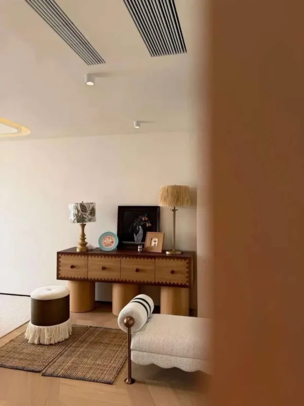 Vintage Scalloped-Trim Oak Sideboard on Cylinder Legs in natural oak — in a room setting
