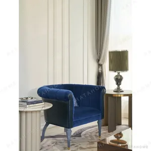 Violet Blue Velvet Armchair in blue — in a room setting
