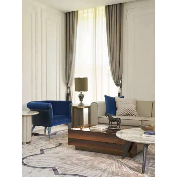Violet Blue Velvet Armchair in blue — in a room setting