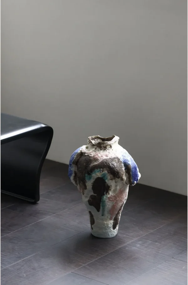 Abstract Textured Art Vase with Blue, Brown and Green Glazes in multicolour — in a room setting