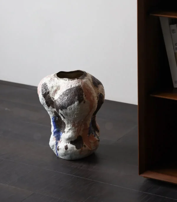 Abstract Textured Art Vase with Blue, Brown and Green Glazes in multicolour — in a room setting