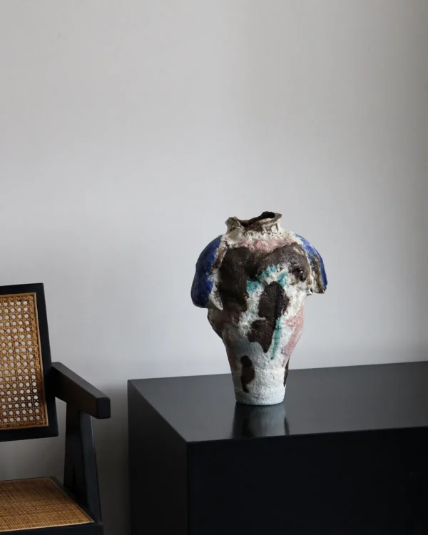 Abstract Textured Art Vase with Blue, Brown and Green Glazes in multicolour — in a room setting