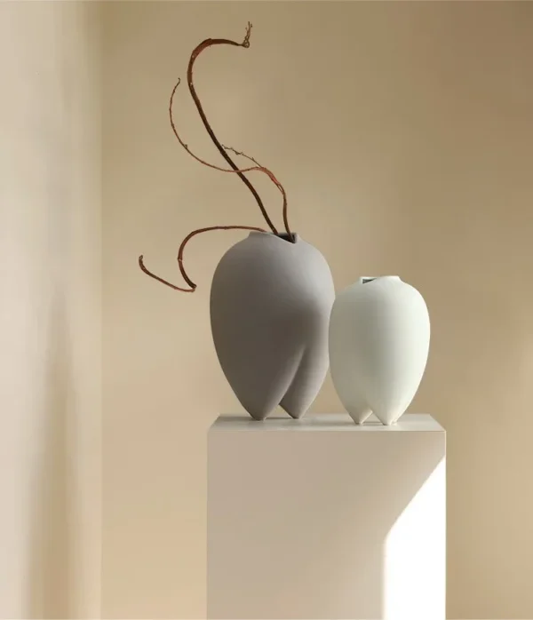 Wabi-Sabi Bisque Ceramic Vases in White and Taupe, Medium — in a room setting