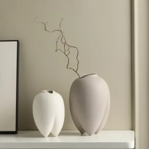 Wabi-Sabi Bisque Ceramic Vases in White and Taupe, Medium — in a room setting