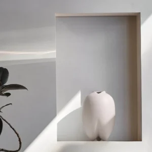 Wabi-Sabi Bisque Ceramic Vases in White and Taupe, Medium — in a room setting