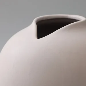 Wabi-Sabi Bisque Ceramic Vases in White and Taupe, Medium — in a room setting