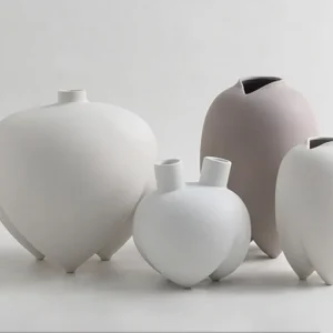Wabi-Sabi Bisque Ceramic Vases in White and Taupe, Medium — in a room setting