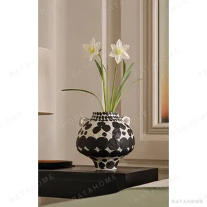 Wabi-Sabi Hand-Painted Black Polka Dot Twin-Ear Jar, Tall in ivory — in a room setting