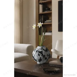Wabi-Sabi Black and White Ribbed Moon Jar, Two Forms in ivory — in a room setting