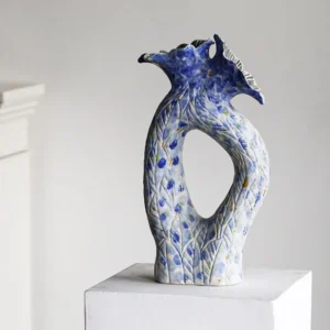 Blue Pierced Sculptural Ceramic Vase with Flared Mouth in blue — front view