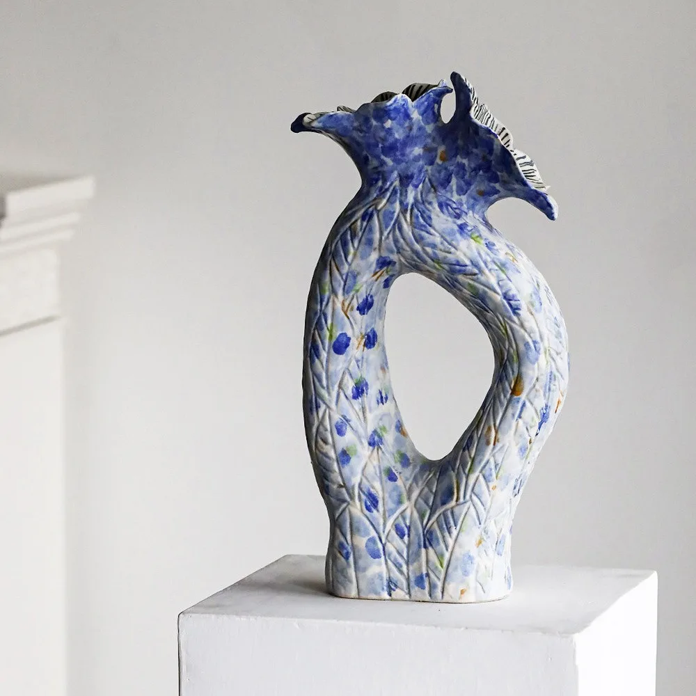 Blue Pierced Sculptural Ceramic Vase with Flared Mouth in blue — front view