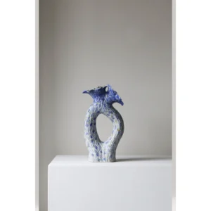 Blue Pierced Sculptural Ceramic Vase with Flared Mouth in blue — in a room setting