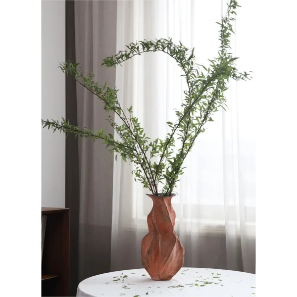 Red Clay Pleated Gourd Stoneware Vase, Medium in rust — in a room setting