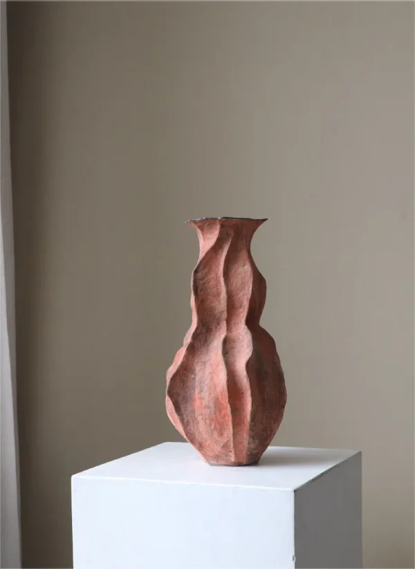 Red Clay Pleated Gourd Stoneware Vase, Medium in rust — in a room setting