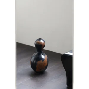 Gourd-Shaped Twin-Ear Ceramic Vase in Black and Rust Glaze — in a room setting