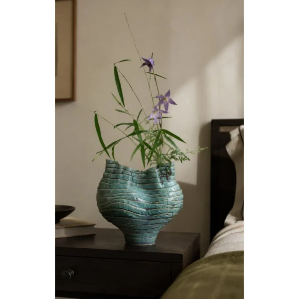 Wabi-Sabi Green Rock Texture Ceramic Vase with Torn Rim in olive — in a room setting