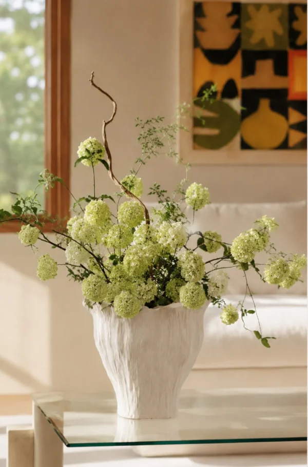 Wabi-Sabi Hand-Pinched Pleated Trumpet Vase in oatmeal — in a room setting