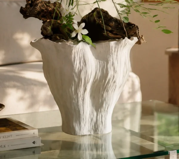 Wabi-Sabi Hand-Pinched Pleated Trumpet Vase in oatmeal — in a room setting