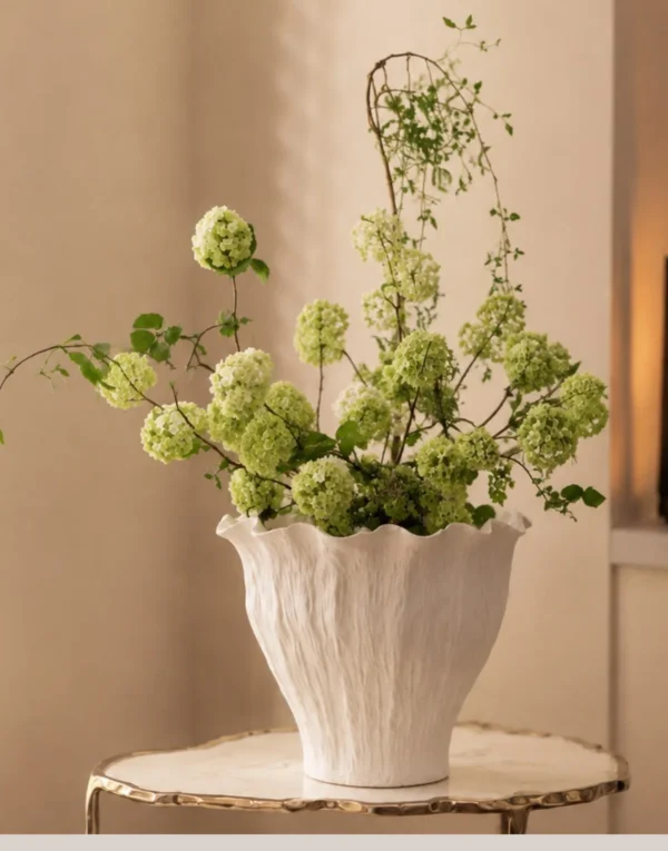 Wabi-Sabi Hand-Pinched Pleated Trumpet Vase in oatmeal — in a room setting